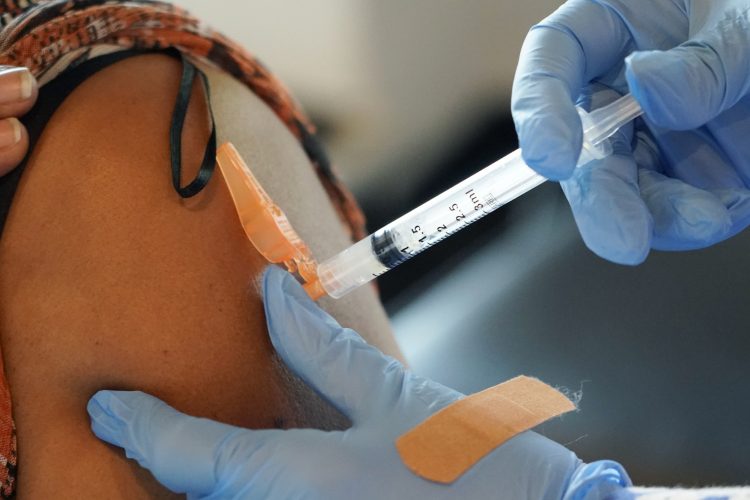 Biden vaccine mandate splits US on party lines: AP-NORC poll